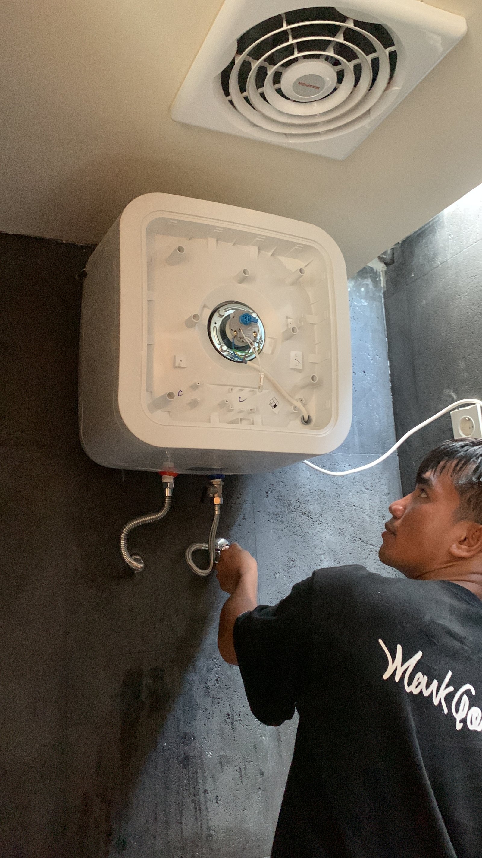 Technician Fixing Water Heater